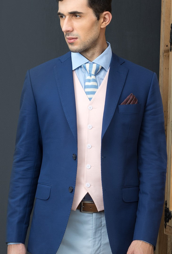 CAN’T TAKE OUR EYES OFF THIS AZURE, DEEP BLUE SINGLE BREASTED COAT PAIRED WITH A PINK WAISTCOAT