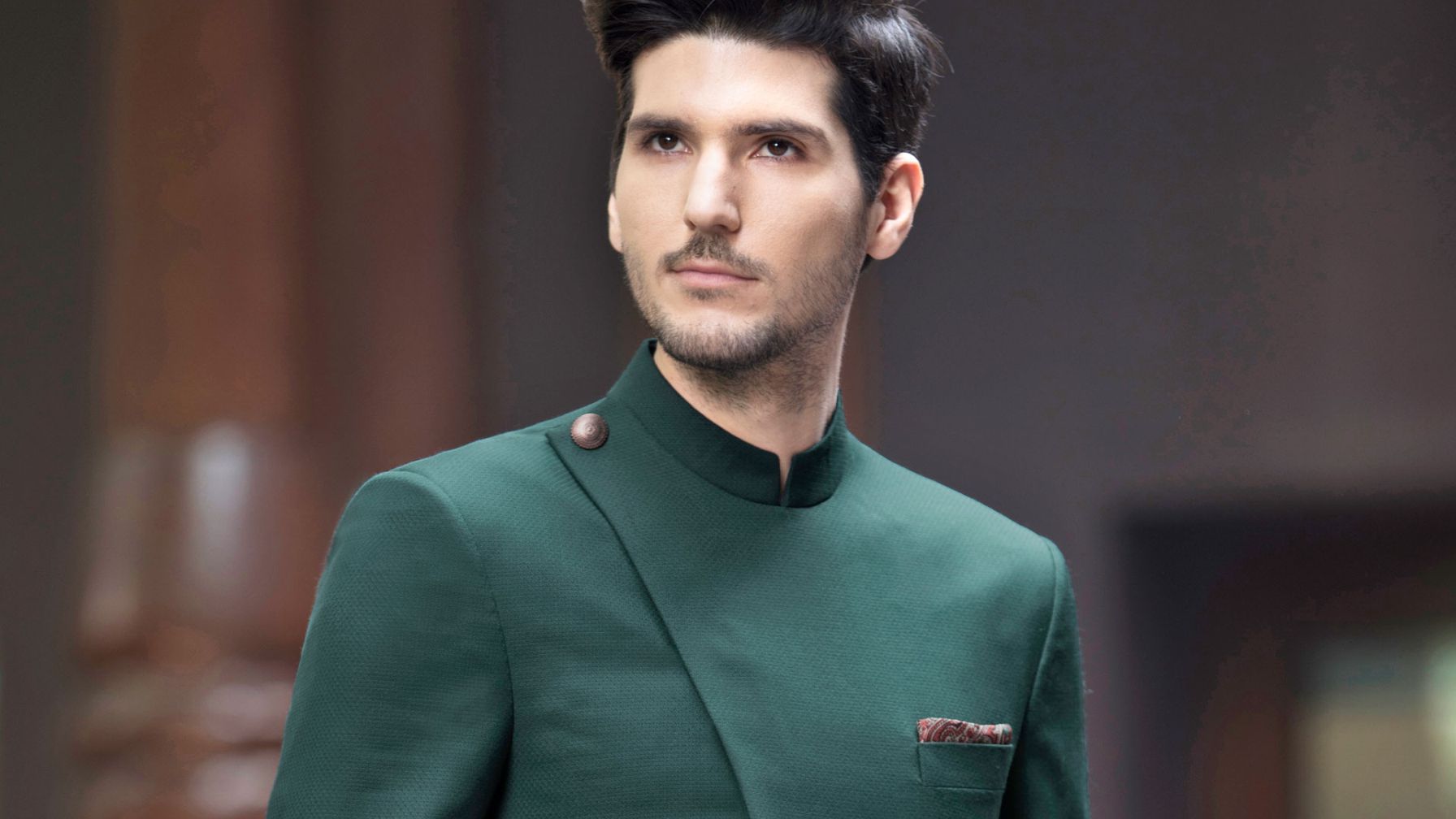 BOTTLE GREEN BANDH GALA STYLED WITH A GOLD BUTTON.