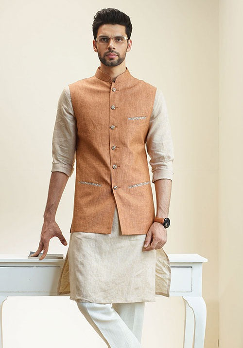 IZMIR BANDHGALA PAIRED WITH A KURTA AND A TROUSER.
