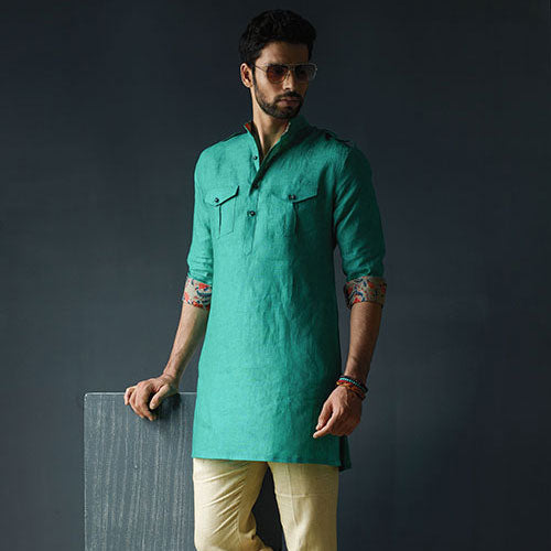PATHANI GREEN LINEN SHORT KURTA WITH PRINTED REVERSE CUFF AND BEIGE PANTS.